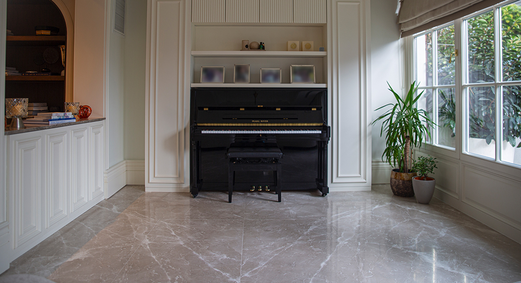 Elegant living room with a black upright piano.